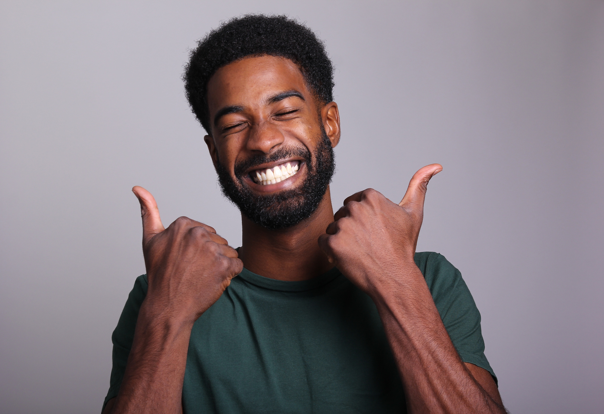 Man Posing with Two Thumbs Up 